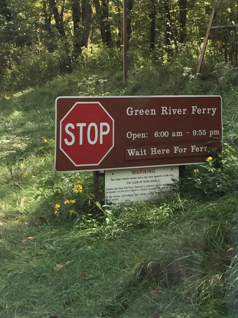 green river ferry sign with hours
