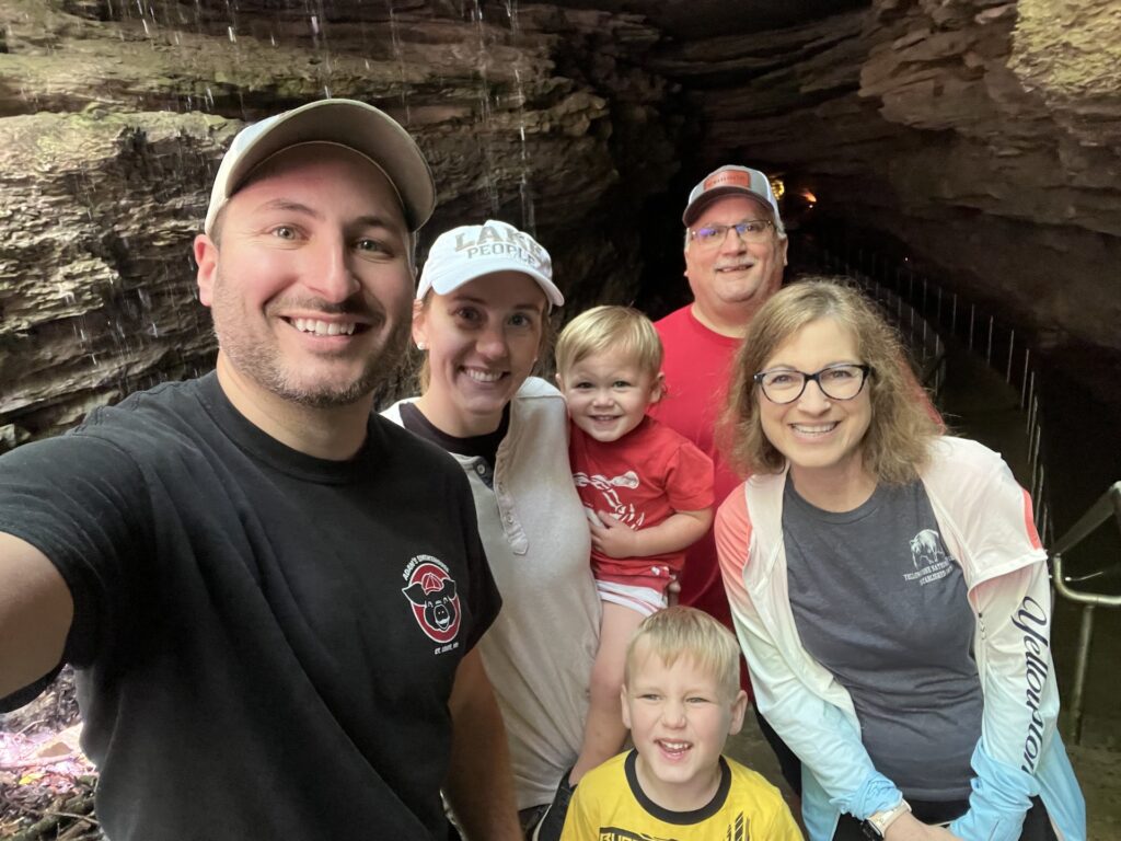 people taking a picture in front of mammoth cave
